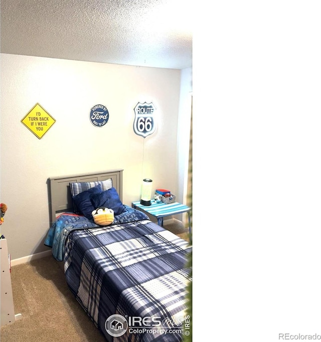 3200 Claremont Ave, Evans, CO 80620 - bedroom with carpet and a textured ceiling