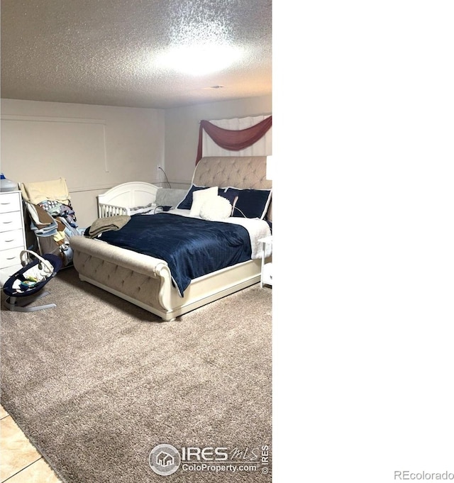 3200 Claremont Ave, Evans, CO 80620 - bedroom with a textured ceiling and carpet
