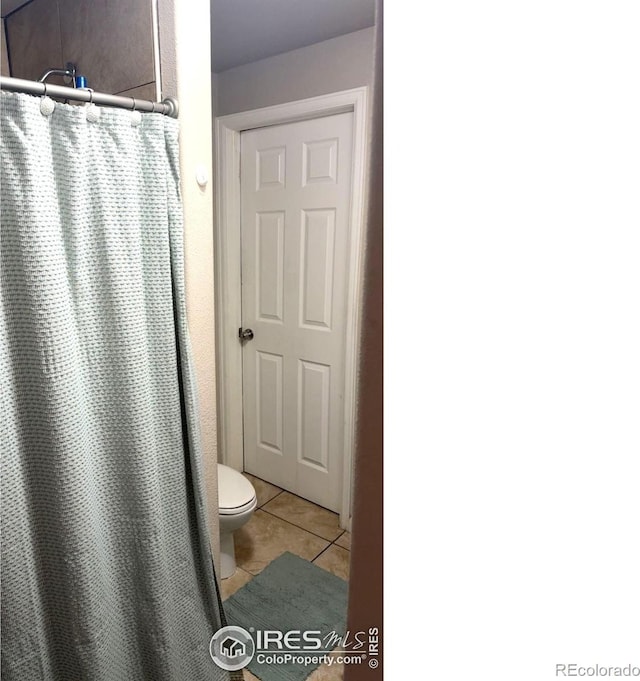 3200 Claremont Ave, Evans, CO 80620 - bathroom with tile patterned floors and a shower with curtain