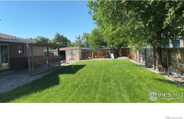 3200 Claremont Ave, Evans, CO 80620 - fenced backyard featuring a shed and a patio area