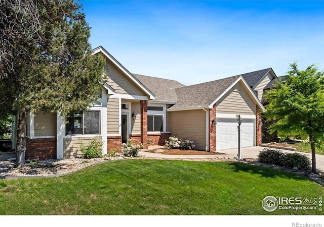 1206 Canvasback Ct, Fort Collins, CO 80525 - view of front of property featuring brick siding, an attached garage, a front lawn, and driveway