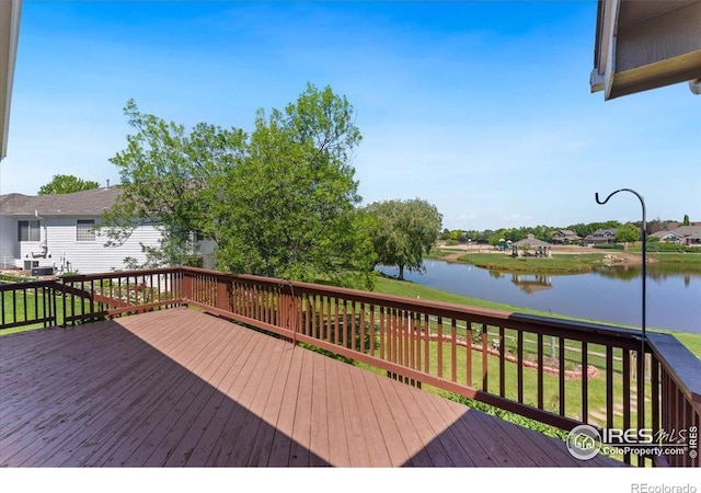 1206 Canvasback Ct, Fort Collins, CO 80525 - deck featuring a water view and a lawn