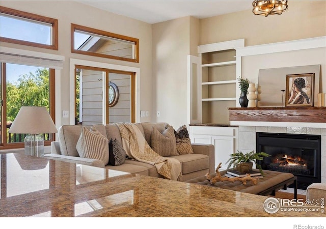 1206 Canvasback Ct, Fort Collins, CO 80525 - living room featuring a tile fireplace