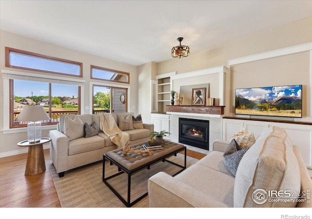 1206 Canvasback Ct, Fort Collins, CO 80525 - living room with wood finished floors and a tile fireplace