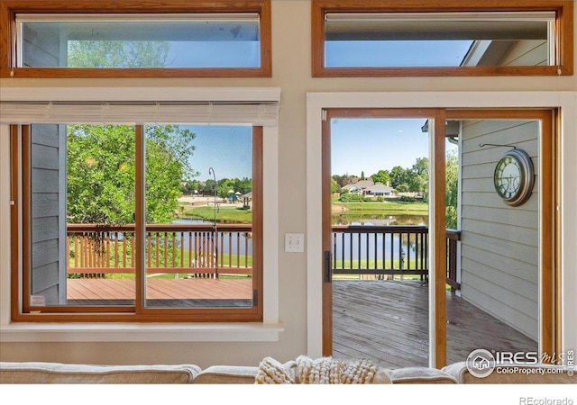 1206 Canvasback Ct, Fort Collins, CO 80525 - doorway with a water view, healthy amount of natural light, and wood finished floors