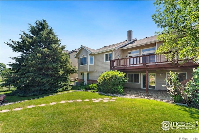1206 Canvasback Ct, Fort Collins, CO 80525 - rear view of house with a yard, a deck, and a chimney