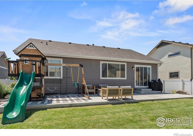 452 Mt Sherman Ave, Severance, CO 80550 - rear view of property with a playground, an outdoor hangout area, roof with shingles, and a patio area