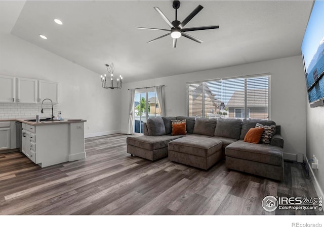452 Mt Sherman Ave, Severance, CO 80550 - living room featuring ceiling fan, a chandelier, dark wood-type flooring, recessed lighting, and high vaulted ceiling