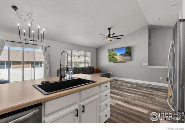 452 Mt Sherman Ave, Severance, CO 80550 - kitchen with appliances with stainless steel finishes, open floor plan, a chandelier, lofted ceiling, and a ceiling fan