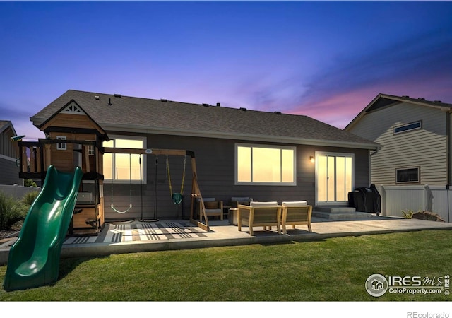 452 Mt Sherman Ave, Severance, CO 80550 - rear view of house with a playground, entry steps, roof with shingles, and a patio area