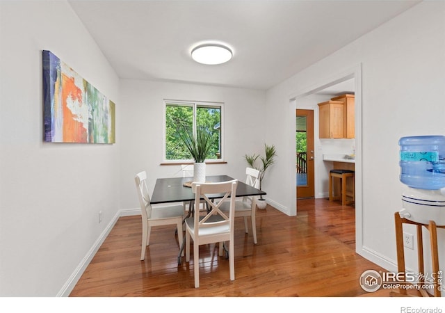 7261 Mount Meeker Rd, Longmont, CO 80503 - dining area featuring light wood-type flooring and baseboards