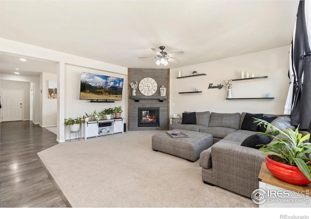6504 Zimmerman Lake Rd, Timnath, CO 80547 - living area with a ceiling fan, wood finished floors, a fireplace, and recessed lighting