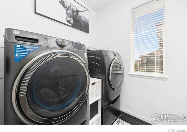 6504 Zimmerman Lake Rd, Timnath, CO 80547 - laundry area featuring washer and clothes dryer and tile patterned flooring