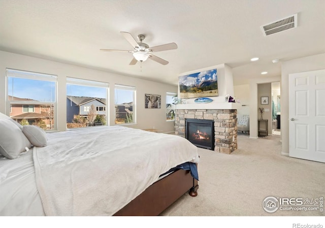 6504 Zimmerman Lake Rd, Timnath, CO 80547 - bedroom featuring a fireplace, carpet, and ceiling fan