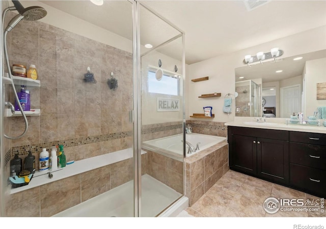 6504 Zimmerman Lake Rd, Timnath, CO 80547 - full bathroom with a stall shower, vanity, and a bath