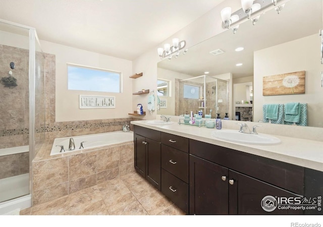 6504 Zimmerman Lake Rd, Timnath, CO 80547 - bathroom featuring double vanity, a shower stall, a bath, and tile patterned flooring