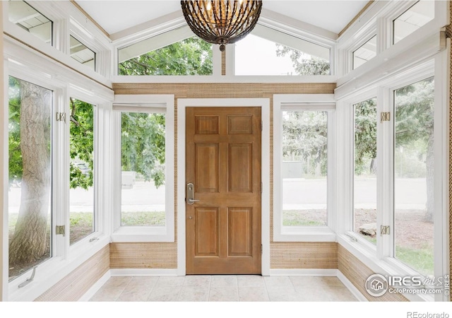 2085 Alpine Dr, Boulder, CO 80304 - unfurnished sunroom with plenty of natural light, tile patterned flooring, and a chandelier