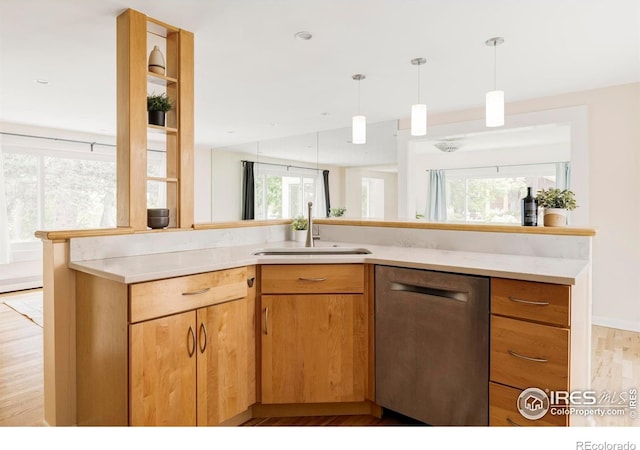 2085 Alpine Dr, Boulder, CO 80304 - kitchen with stainless steel dishwasher, light wood-style floors, light countertops, and pendant lighting