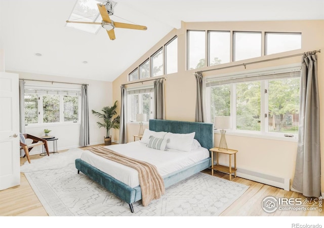 2085 Alpine Dr, Boulder, CO 80304 - bedroom with multiple windows, high vaulted ceiling, wood finished floors, beam ceiling, and a ceiling fan