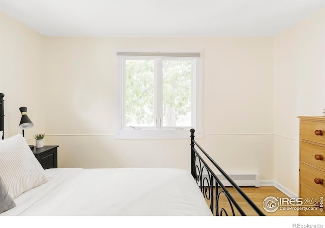 2085 Alpine Dr, Boulder, CO 80304 - bedroom featuring wood finished floors and baseboards
