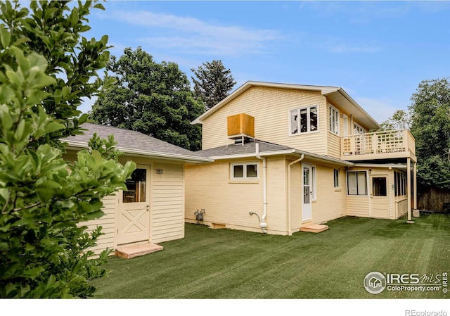2085 Alpine Dr, Boulder, CO 80304 - rear view of house with a balcony, a yard, and a shingled roof