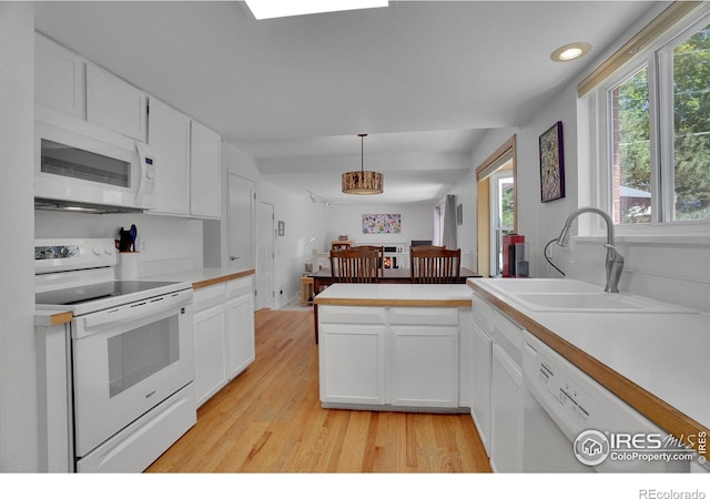 1590 Findlay Way, Boulder, CO 80305 - kitchen with white appliances, light wood-style floors, white cabinetry, light countertops, and recessed lighting