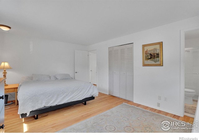 1590 Findlay Way, Boulder, CO 80305 - bedroom featuring wood finished floors, a closet, and ensuite bathroom
