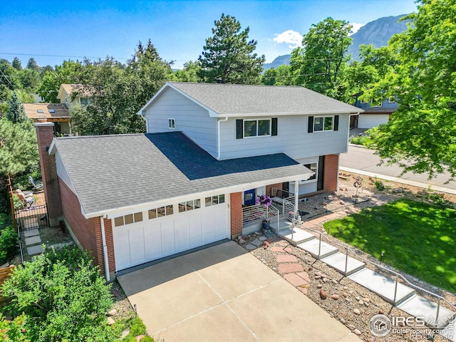 1590 Findlay Way, Boulder, CO 80305 - traditional-style house with roof with shingles, brick siding, and a mountain view