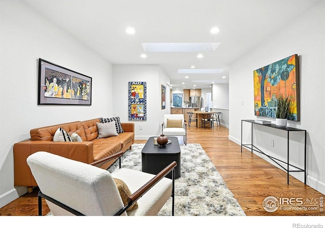 2433 Linden Dr, Boulder, CO 80304 - living area featuring a skylight, recessed lighting, and light wood finished floors