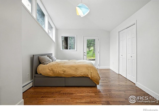2433 Linden Dr, Boulder, CO 80304 - bedroom with a baseboard heating unit, access to outside, wood finished floors, and lofted ceiling