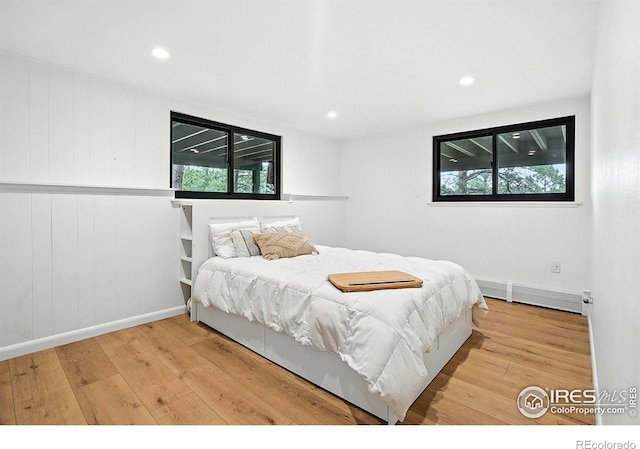 2433 Linden Dr, Boulder, CO 80304 - bedroom featuring wood finished floors, a baseboard radiator, and recessed lighting