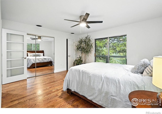 2433 Linden Dr, Boulder, CO 80304 - bedroom with wood finished floors, two closets, and a ceiling fan