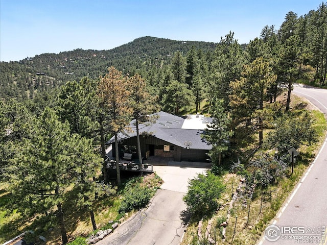 2433 Linden Dr, Boulder, CO 80304 - aerial overview of property's location with a heavily wooded area and a mountainous background