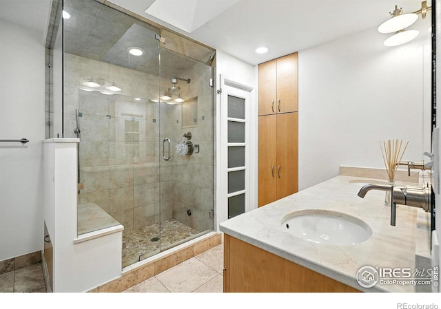 2433 Linden Dr, Boulder, CO 80304 - full bath with double vanity, a shower stall, tile patterned floors, and recessed lighting