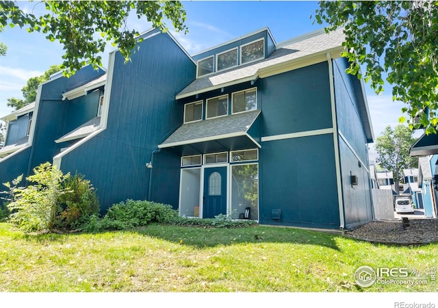 1731 Springmeadows Ct Unit A, Fort Collins, CO 80525 - mid-century home with a front yard and a shingled roof