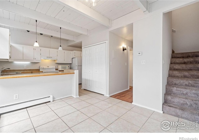 1731 Springmeadows Ct Unit A, Fort Collins, CO 80525 - kitchen featuring white appliances, under cabinet range hood, baseboard heating, light tile patterned floors, and a peninsula
