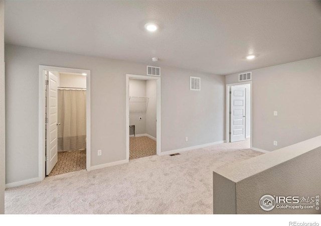 620 Apache Trl Unit 2, Ault, CO 80610 - unfurnished living room featuring carpet and recessed lighting