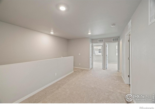 620 Apache Trl Unit 2, Ault, CO 80610 - spare room featuring light carpet, a smoke detector, and recessed lighting