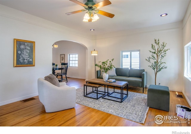 403 W Cannon St, Lafayette, CO 80026 - living area featuring arched walkways, wood finished floors, ceiling fan, and recessed lighting