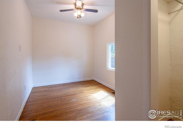 403 W Cannon St, Lafayette, CO 80026 - unfurnished room with wood finished floors, ceiling fan, and a textured wall
