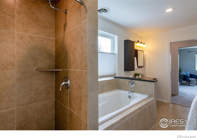 403 W Cannon St, Lafayette, CO 80026 - bathroom featuring a bath, a tile shower, tile patterned floors, and recessed lighting