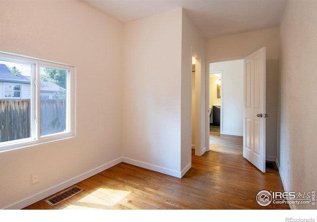 403 W Cannon St, Lafayette, CO 80026 - empty room featuring wood finished floors and baseboards