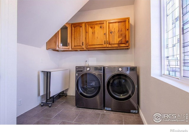 403 W Cannon St, Lafayette, CO 80026 - washroom featuring independent washer and dryer, cabinet space, and dark tile patterned flooring
