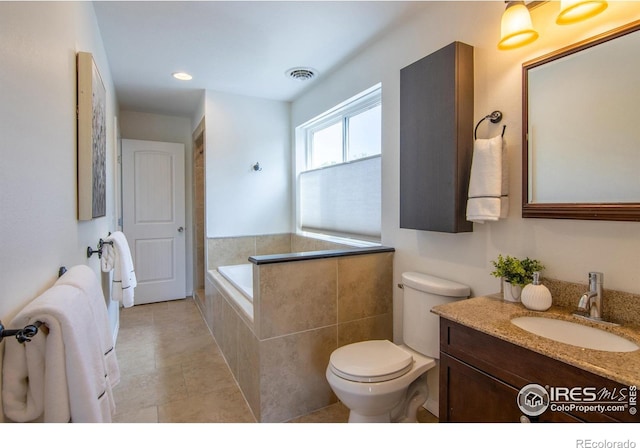 403 W Cannon St, Lafayette, CO 80026 - bathroom featuring vanity, tiled bath, recessed lighting, and tile patterned floors