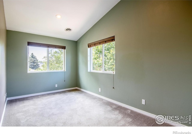 403 W Cannon St, Lafayette, CO 80026 - carpeted spare room with baseboards and vaulted ceiling