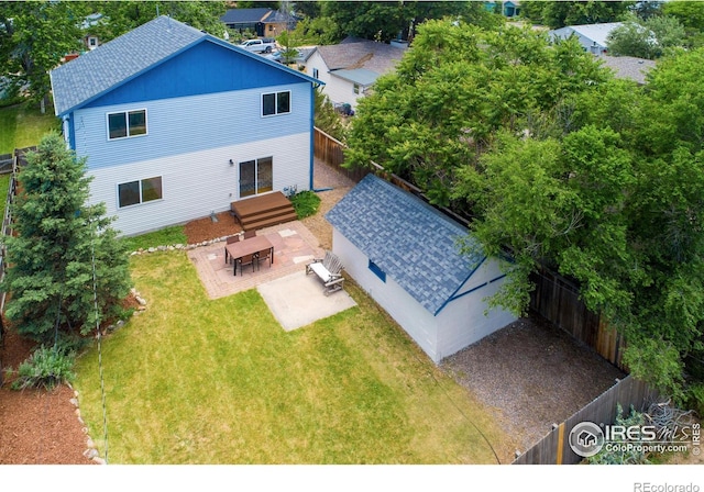 403 W Cannon St, Lafayette, CO 80026 - rear view of house with a patio, a fenced backyard, and roof with shingles