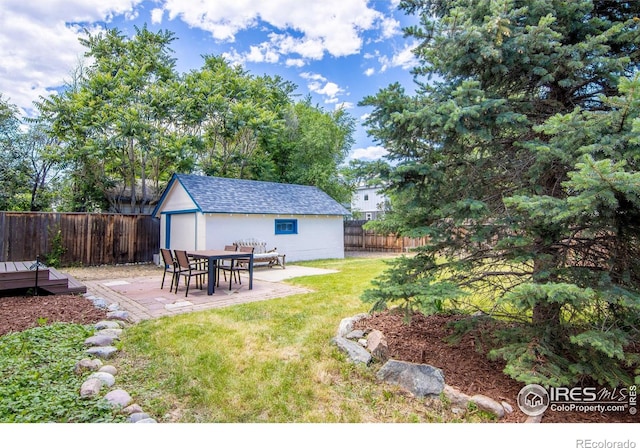 403 W Cannon St, Lafayette, CO 80026 - fenced backyard with a patio, an outdoor structure, and a deck