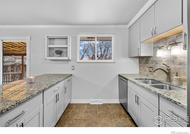 6864 Balsam St, Arvada, CO 80004 - kitchen featuring stainless steel dishwasher, decorative backsplash, light stone counters, crown molding, and white cabinetry