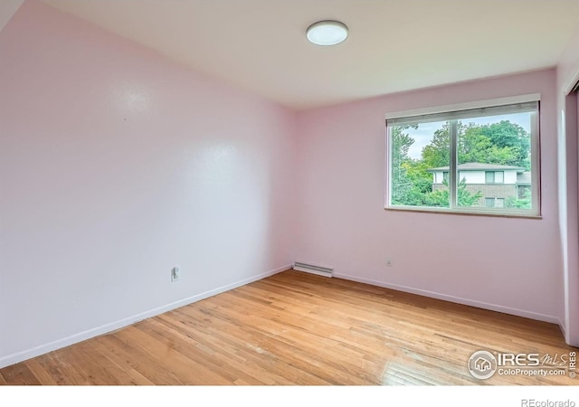 6864 Balsam St, Arvada, CO 80004 - spare room featuring light wood finished floors and baseboards