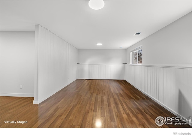 6864 Balsam St, Arvada, CO 80004 - empty room with wood finished floors and a wainscoted wall